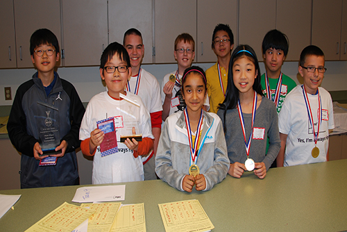 Students from public schools wearing medals of achievement